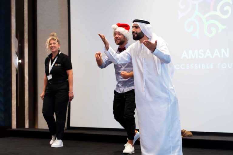 Image 2 - Majed Al Bloushi, Amsaan Brand Ambassador and Relationship Manager, takes the stage with Deaf comedians